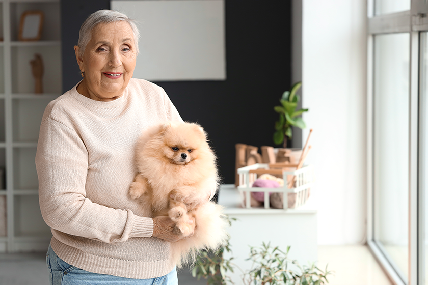 senior-woman-pomeranian-dog